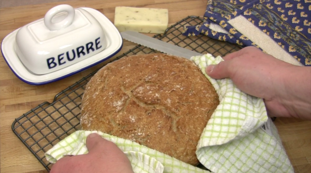 A rustic loaf of bread fresh from the oven.