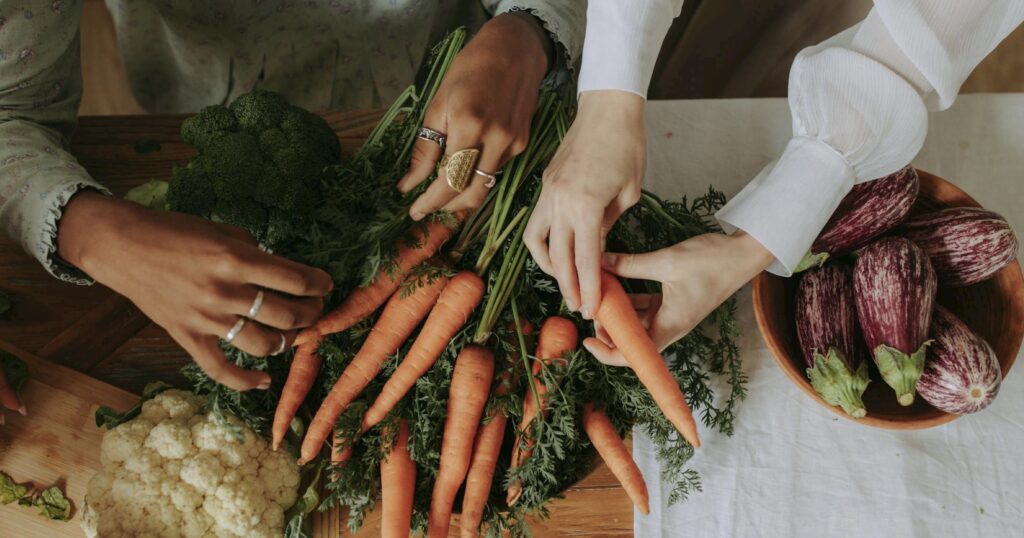 Hands sorting carrots