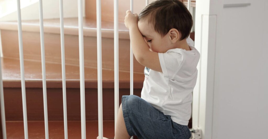 A child thwarted by safety bars.